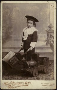 Portrait of a Young Boy Posing with a Handcart by English School