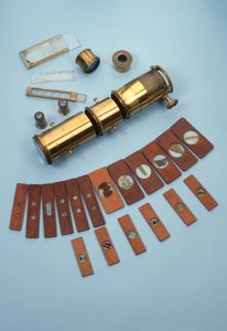 Projection microscope, retailed by Watkins & Hill, London, intended for use with a magic lantern, together with 18 natural history slides, c.1870