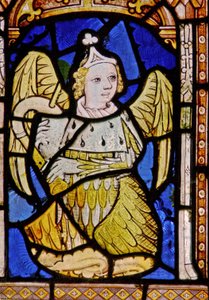 The East window depicting a musician angel with cornamuse by English School