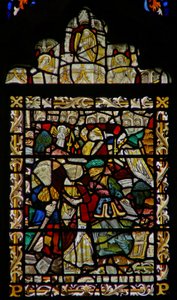 The east window depicting St John on Patmos; angel musicians in the canopy by English School