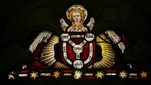 Window depicting an angel with a Trinity shield by English School