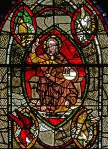 Window depicting Christ in Majesty surrounded by Evangelist symbols