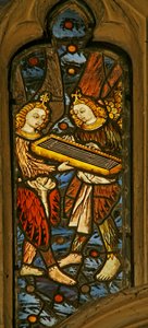 Window depicting musician angels with a clavichord by English School
