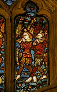 Window depicting musician angels with pipes by English School