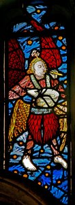 Window depicting a musician angel with pipe and tabor by English School