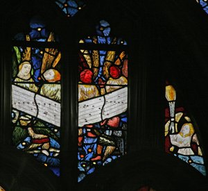 Window depicting the angelic choir singing; angel censing