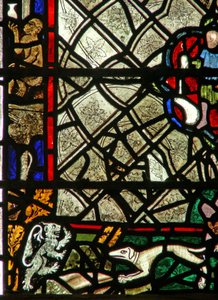 Window w40 depicting a border panel with monkey, lion and a hound; grisaille by English School