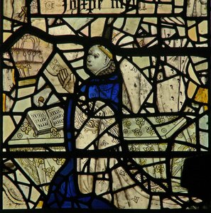 Window W46 depicting a donor priest by English School