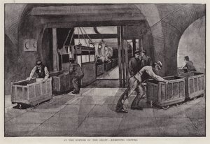 Removing empty coal trucks at the bottom of a mine shaft