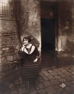 La Villette. Rue Asselin, Prostitute Waiting in Front of Her Door by Eugène Atget