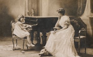 Portrait of a woman watching a young girl playing the piano by European Photographer