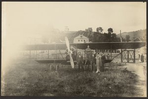 Group Portrait in Front of Airplane by Fedele Azari