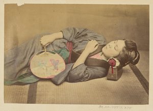 Sleeping Japanese woman holding a fan by Felice Beato
