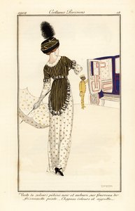 Woman in waistcoat of pekine velvet over a printed sheath dress