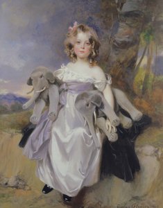 Portrait of a girl with toy elephants