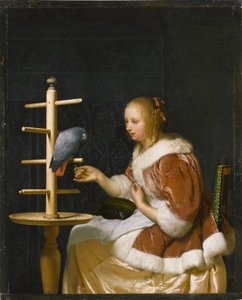 Young Woman Feeding a Parrot