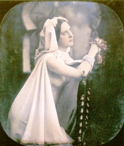 A Woman Kneeling on a Chair Praying