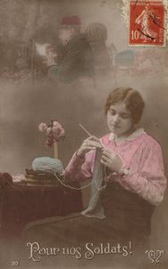 A Young Woman Knits Whilst Thinking About Her Soldier Who is Writing a Letter Home by French Photographer