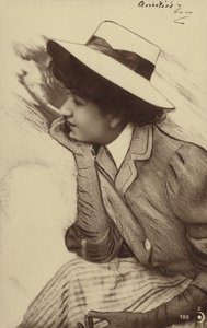 A young woman wearing a hat and smoking by French Photographer