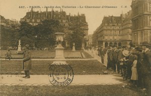 Bird charmer in the Jardin des Tuileries, Paris