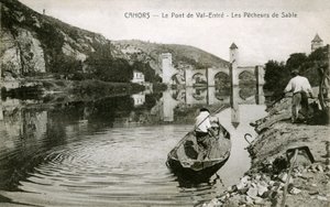 Cahors at the beginning of the 20th century: sand fishermen and their boat on the Lot, bridge of Valentre by French Photographer