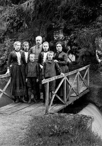 Family of Urban Dwellers Posing in Their Garden by French Photographer