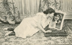 Girl smiling at herself in the mirror