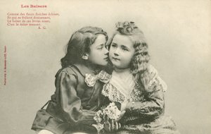 Little boy kissing a little girl by French Photographer