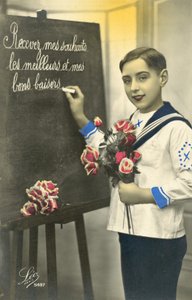 Schoolboy writing on a blackboard