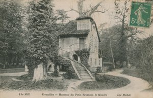 The mill at Hameau de la Reine, a rustic retreat built for Marie Antoinette in the park of the Chateau de Versailles near the Petit Trianon. Postcard sent in 1913 by French Photographer