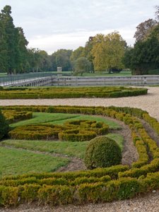 A View of the Chateau: The Gardens by French School