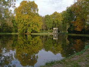 A view of the Chateau: the gardens with the Temple of Venus by French School