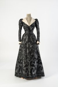 Black Figured Silk Dress with High Neck Chemisette of Cream Lace, Early 1890s