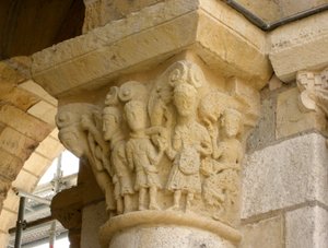 Capital Depicting a Group of Men