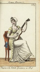 Fashionable woman playing the guitar