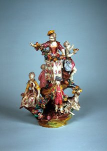 Statuette of women and children grouped on a rockery by French School