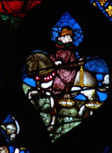 The west rose window depicting a scene from the Book of Revelation: A horseman carrying the scales to measure the wheat and barley by French School