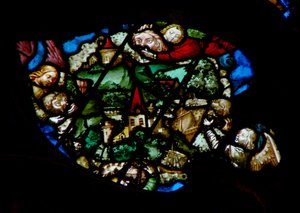 The west rose window depicting a scene from the Book of Revelation: Angels holding back the wind from the land and the ships of the sea