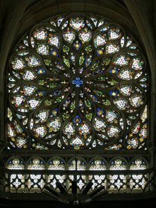 Window S rose depicting the south rose window, built in the early C16, contains much of its original decorative glass, though it was much restored in 1865 by French School