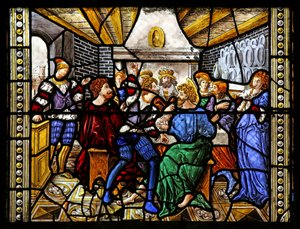 Window depicting St Thomas in India is invited to the wedding of Pelagius, is beaten by a servant who is in turn eaten by a lion. A dog brings in the servant
