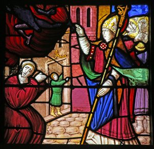 Window depicting the Life of St Remi. He delivers a possessed soul