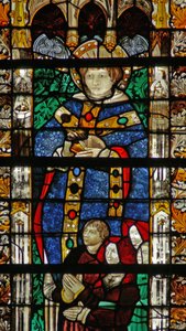 Window depicting St Séverin and a family of donors by French School