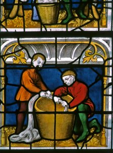 Window w25 depicting a draper at work in the Drapers window