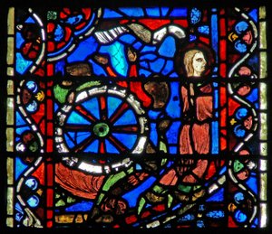 Window depicting a scene from the life of St Catherine: the torturers prepare the wheel for her ordeal by French School