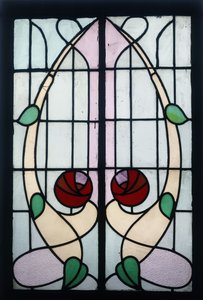 A stained glass panel depicting stylised roses by George Walton