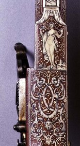 Handle of a wheel-lock rifle decorated with ivory figures and arabesques by German School