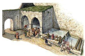 Middle Ages: reconstruction of a spring water fountain in central Italy in the 15th century. It is used as a washing house, watering and water point for the inhabitants of the city.