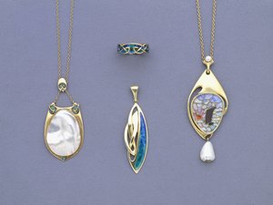 A Group of Liberty & Co Yellow Metal and Enamel Pendants and a Ring Designed by Archibald Knox by Giovanni Bigatti