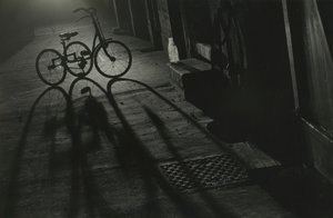 Silhouette of a Tricycle at Night