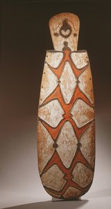 Oval Asmat Shield, Carved in Relief with Stylised Figures, a Mask at the Top by Guinean New